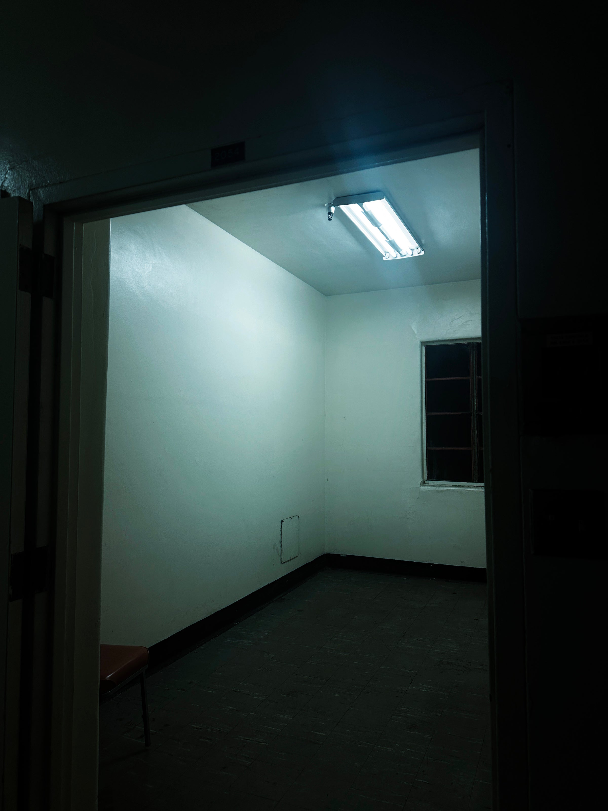 Dark room with a light on the ceiling